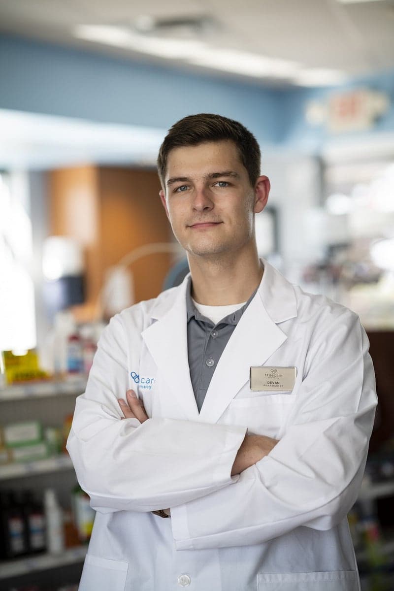 Devan Conley, PharmD, standing in the pharmacy.